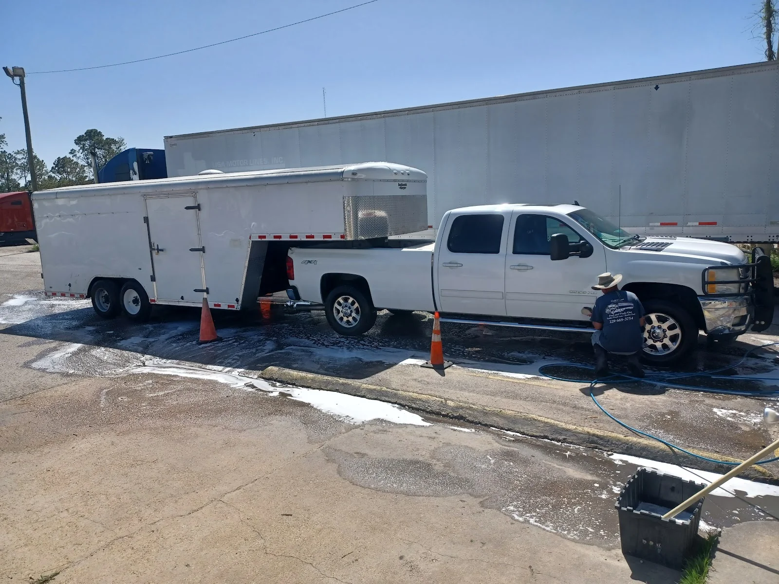 Pickup and gooseneck trailer washout in progress in Gulfport, MS